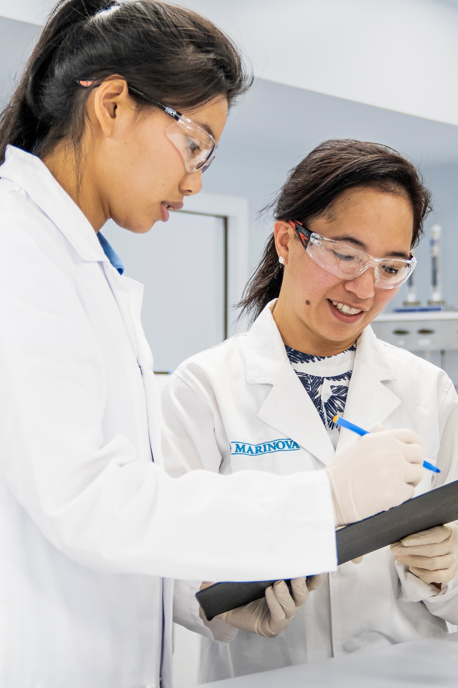 Tania Casimaty and Michelle Mendoza working in Marinova's laboratory