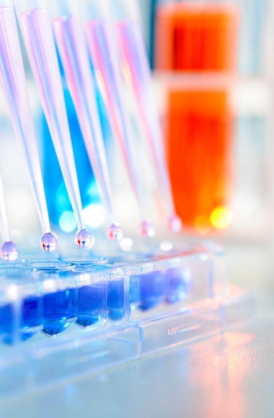 Brightly coloured image of pipettes in lab