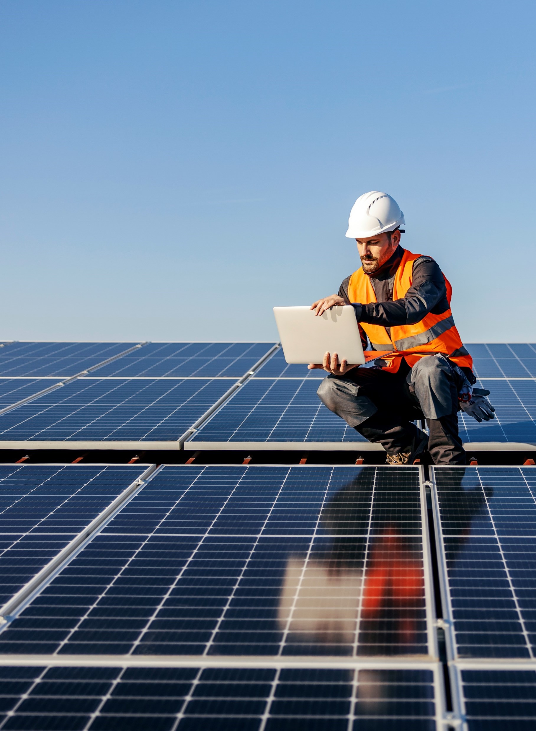 Man on solar panels