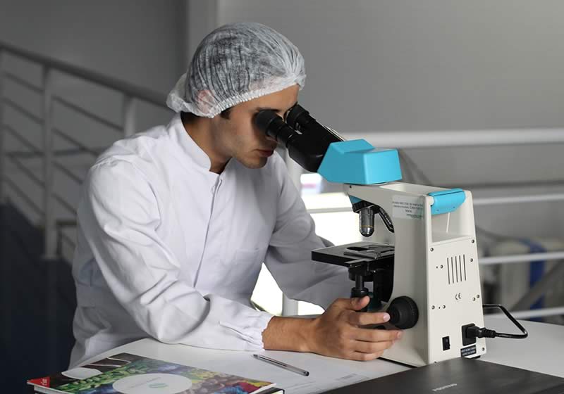 Scientist with microscope